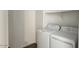 Functional laundry room featuring a washer and dryer, with plenty of space for storage at 15769 W Beryl Ave, Waddell, AZ 85355