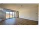 Bright living room with natural light and sliding glass doors to the back patio at 15769 W Beryl Ave, Waddell, AZ 85355