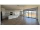 Open-concept kitchen and living room area with modern finishes at 15769 W Beryl Ave, Waddell, AZ 85355