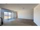 Spacious open living room with sliding glass doors overlooking the backyard at 15769 W Beryl Ave, Waddell, AZ 85355