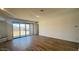 Bright living room featuring a large glass sliding door overlooking the backyard at 15769 W Beryl Ave, Waddell, AZ 85355