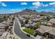 Aerial view of a neighborhood with mountain views and blue skies at 16018 N 17Th Way, Phoenix, AZ 85022