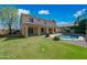 Backyard featuring a sparkling pool, lush landscaping, and a covered patio for relaxing and entertaining at 16018 N 17Th Way, Phoenix, AZ 85022