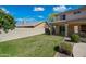 Spacious backyard featuring a well-maintained lawn and patio, perfect for outdoor activities and relaxation at 16018 N 17Th Way, Phoenix, AZ 85022