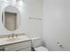 Cozy bathroom with granite countertop and round mirror at 16018 N 17Th Way, Phoenix, AZ 85022