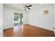 Bedroom with hardwood floors, modern lighting, and a sliding door leading to a patio at 16018 N 17Th Way, Phoenix, AZ 85022