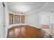 Dining room with hardwood floors, bay windows, and tray ceiling with modern lighting at 16018 N 17Th Way, Phoenix, AZ 85022