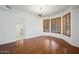 Dining area featuring hardwood floors, plantation shutters, and access to living areas at 16018 N 17Th Way, Phoenix, AZ 85022