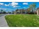 A landscaped front yard with a well-maintained lawn and a three car garage adds to the curb appeal at 16018 N 17Th Way, Phoenix, AZ 85022