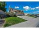 This home features a lush lawn, three-car garage, and well-manicured shrubs at 16018 N 17Th Way, Phoenix, AZ 85022