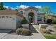 Inviting front entrance with decorative windows, an arched doorway, and manicured landscaping at 16018 N 17Th Way, Phoenix, AZ 85022