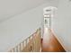 Hallway with hardwood floors and white walls, creating a bright and airy atmosphere at 16018 N 17Th Way, Phoenix, AZ 85022