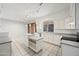 Open kitchen featuring white cabinets, an island, tile floors and modern lighting at 16018 N 17Th Way, Phoenix, AZ 85022