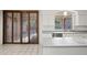 Modern kitchen with stainless steel appliances, an island, and access to the dining area at 16018 N 17Th Way, Phoenix, AZ 85022