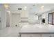 Well-equipped kitchen with bright lighting and modern appliances nearby living area at 16018 N 17Th Way, Phoenix, AZ 85022