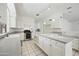 Modern kitchen with large island, stainless appliances, and ample storage at 16018 N 17Th Way, Phoenix, AZ 85022