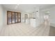 Open floor plan with tile flooring leading to outdoor patio and kitchen at 16018 N 17Th Way, Phoenix, AZ 85022
