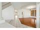 Bright living room with ceramic floors, staircase access to the upper level, and hardwood floor entryway at 16018 N 17Th Way, Phoenix, AZ 85022
