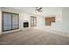 Spacious living room boasts fireplace, large windows, and plush carpet at 16018 N 17Th Way, Phoenix, AZ 85022