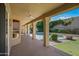 Covered patio overlooking the backyard, pool, and beautiful landscaping at 16018 N 17Th Way, Phoenix, AZ 85022