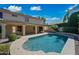 Backyard featuring a sparkling pool, lush landscaping, and a covered patio, creating an inviting outdoor oasis at 16018 N 17Th Way, Phoenix, AZ 85022
