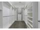 Spacious walk-in closet with custom shelving and ample storage space for clothes and accessories at 16683 S 180Th Dr, Goodyear, AZ 85338