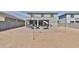 Expansive backyard showcasing a brick patio, perfect for entertaining, complete with a swing and comfortable seating at 16873 W Fetlock Trl, Surprise, AZ 85387