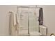 Bathroom featuring a shower stall with a sliding glass door at 16873 W Fetlock Trl, Surprise, AZ 85387