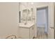 Bathroom featuring a sink with vanity with view to glass shower at 16873 W Fetlock Trl, Surprise, AZ 85387
