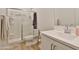 Bathroom with glass shower, toilet, and sink with vanity at 16873 W Fetlock Trl, Surprise, AZ 85387