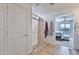 Bathroom entrance with a large glass shower and tile flooring at 16873 W Fetlock Trl, Surprise, AZ 85387