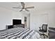 Cozy bedroom with a ceiling fan, closet, and carpet floors at 16873 W Fetlock Trl, Surprise, AZ 85387