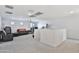 Spacious bonus room with neutral carpet, ceiling fan, and a window at 16873 W Fetlock Trl, Surprise, AZ 85387