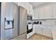 Kitchen featuring stainless steel refrigerator and built in microwave at 16873 W Fetlock Trl, Surprise, AZ 85387