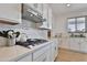 Gourmet kitchen featuring a gas cooktop and stainless steel appliances at 16873 W Fetlock Trl, Surprise, AZ 85387