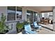 Relaxing outdoor patio with comfortable seating, ideal for enjoying the fresh air and peaceful surroundings at 16873 W Fetlock Trl, Surprise, AZ 85387
