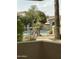 Private patio overlooking the community pool and mature landscaping at 1747 E Northern E Ave # 166, Phoenix, AZ 85020