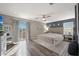 Spacious main bedroom with wood floors and lots of natural light at 18039 W Sunnyslope Ln, Waddell, AZ 85355