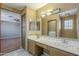 Bathroom with double sinks and a view to the bedroom at 18194 N 59Th Ln, Glendale, AZ 85308