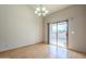 Well-lit dining room with a view of the pool through sliding glass doors and laminate flooring at 18194 N 59Th Ln, Glendale, AZ 85308