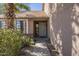 Inviting front entrance with well maintained landscaping and unique front door at 18194 N 59Th Ln, Glendale, AZ 85308