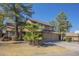 Inviting two-story house with a two-car garage, complemented by palm trees and a basketball hoop at 18194 N 59Th Ln, Glendale, AZ 85308