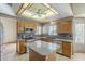 Stylish kitchen with stainless steel appliances, tile backsplash, granite countertops, and spacious center island at 18194 N 59Th Ln, Glendale, AZ 85308