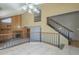 Upstairs landing with tile flooring overlooks the large great room with fireplace at 18194 N 59Th Ln, Glendale, AZ 85308
