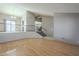 Open-concept layout with laminate flooring, staircase, and lots of natural light at 18194 N 59Th Ln, Glendale, AZ 85308