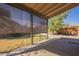 Covered back patio with a view to a backyard with green grass at 18194 N 59Th Ln, Glendale, AZ 85308