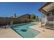 The backyard pool is surrounded by concrete decking and a block fence at 18194 N 59Th Ln, Glendale, AZ 85308