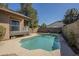 A refreshing backyard pool is surrounded by a concrete deck and block wall at 18194 N 59Th Ln, Glendale, AZ 85308