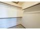 Walk-in closet with built-in shelves offering ample storage space at 18194 N 59Th Ln, Glendale, AZ 85308