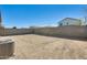Backyard view with surrounding block wall ready for a personal landscape design at 19685 W Roma Ave, Litchfield Park, AZ 85340